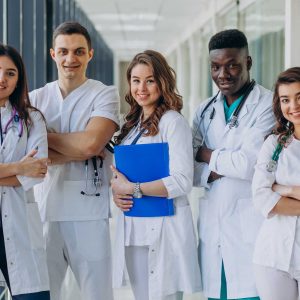 team-young-specialist-doctors-standing-corridor-hospital